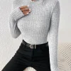 Top de manga larga de punto con cuello volante Slim Fashion