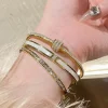 1Pulsera chapada en oro con circonita de acero inoxidable de titanio