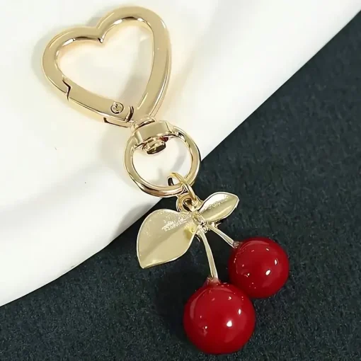 Amuleto para bolso con forma de corazón y flor de cerezo