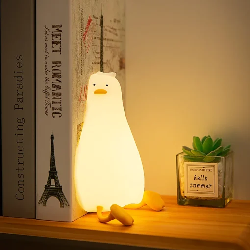 Luz nocturna de pato acostado con luz de palmaditas de silicona recargable por USB