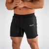 Pantalones deportivos cortos de gimnasio deportivos para hombre con bolsillo con cremallera