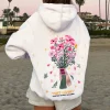 Sudadera con capucha de mujer con estampado de flores en la espalda